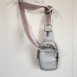 Elegant Silver Crossbody Bag with Patterned Strap